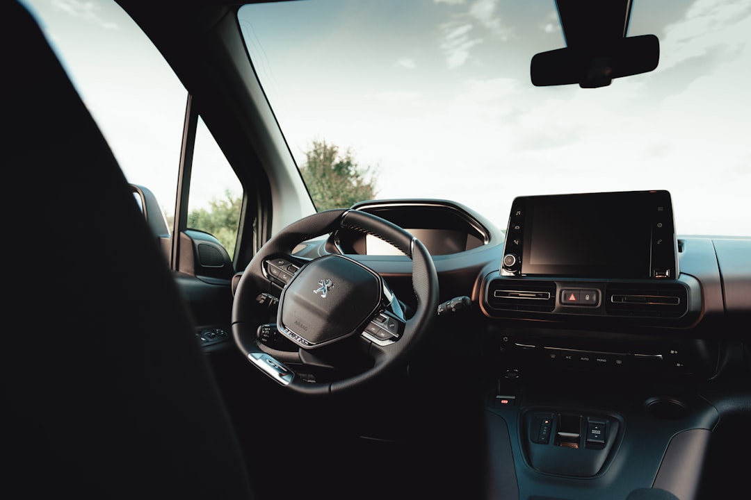 Modern vehicle interior dashboard showing advanced technology and electrical system components