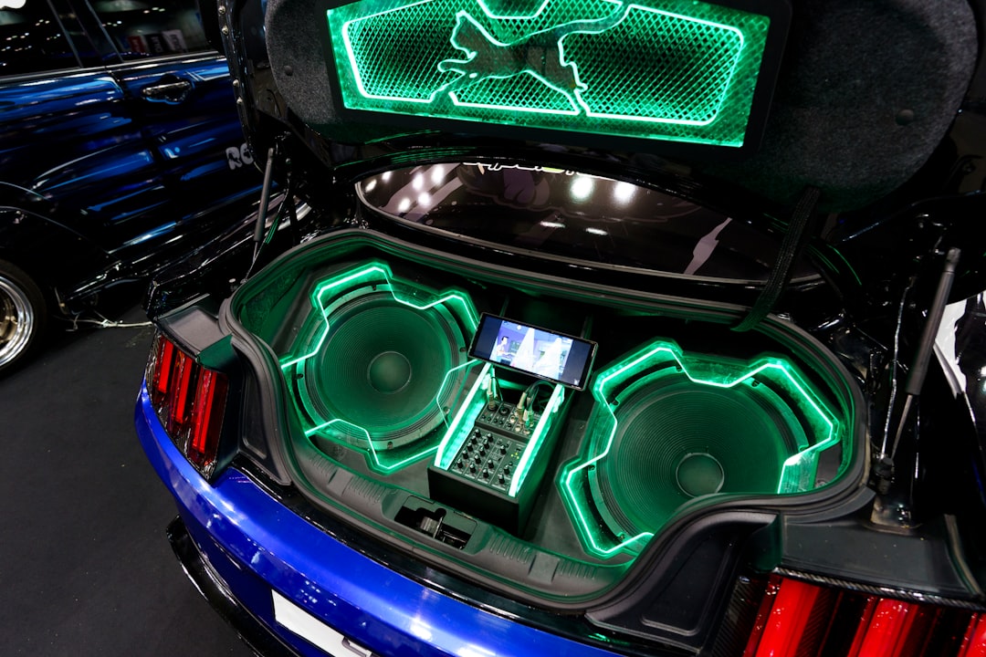 Professional car audio system installation showing speaker components and amplifier wiring